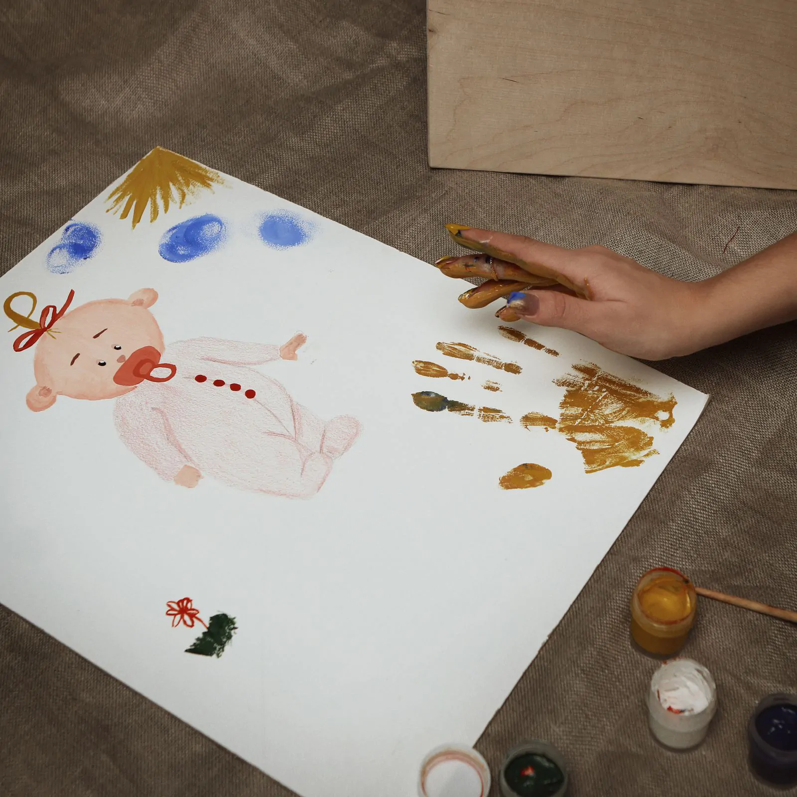 Handprint pumpkin art — Halloween crafts for toddlers